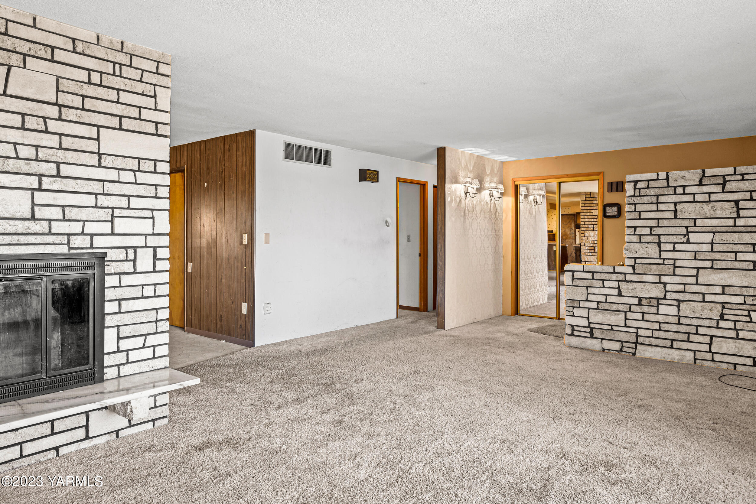3570 Lateral B Road Wapato, WA 98951 - Photo 19 of 32 a view of livingroom with an empty space and a fireplace