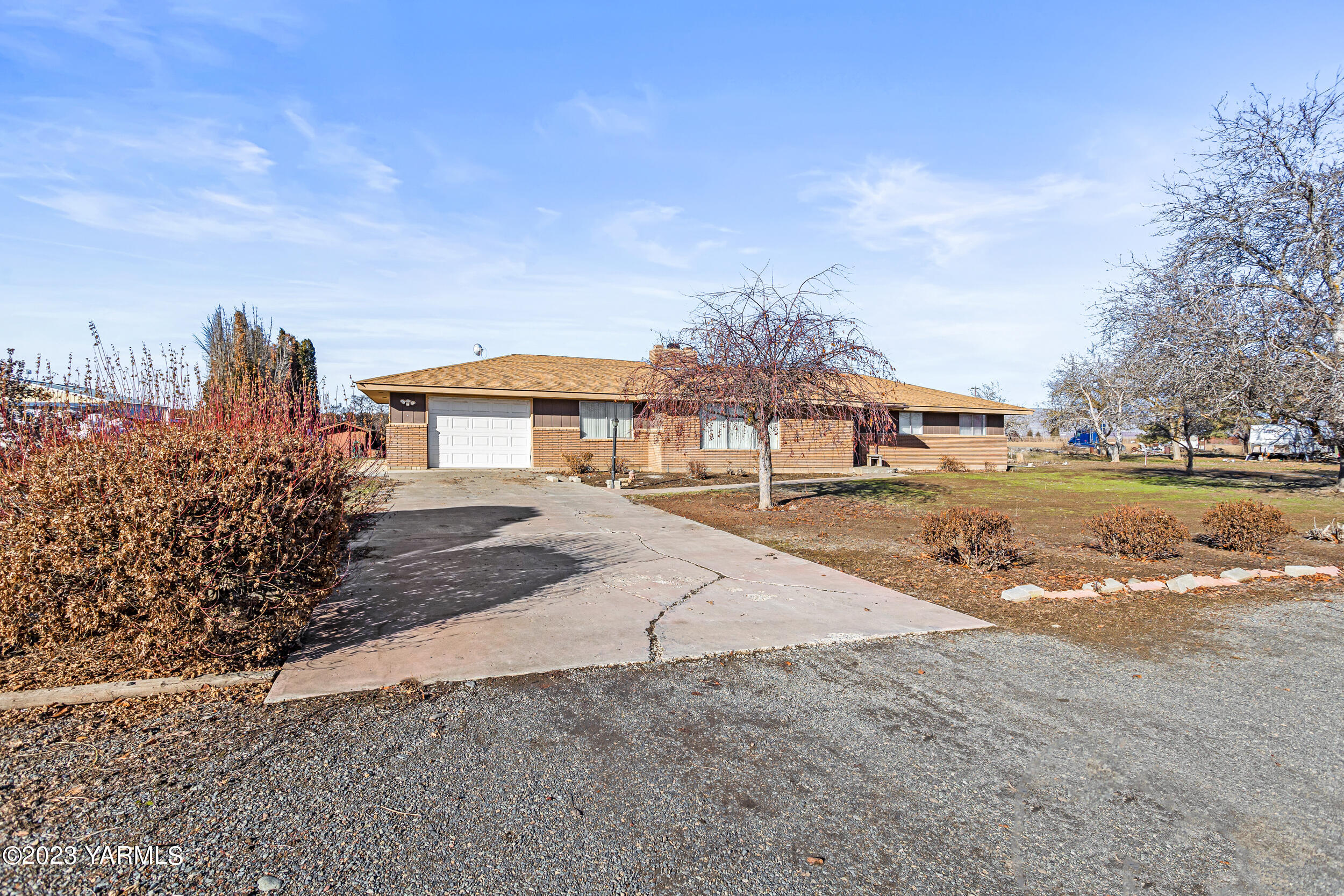 3570 Lateral B Road Wapato, WA 98951 - Photo 3 of 32 a front view of a house with a yard and lake view