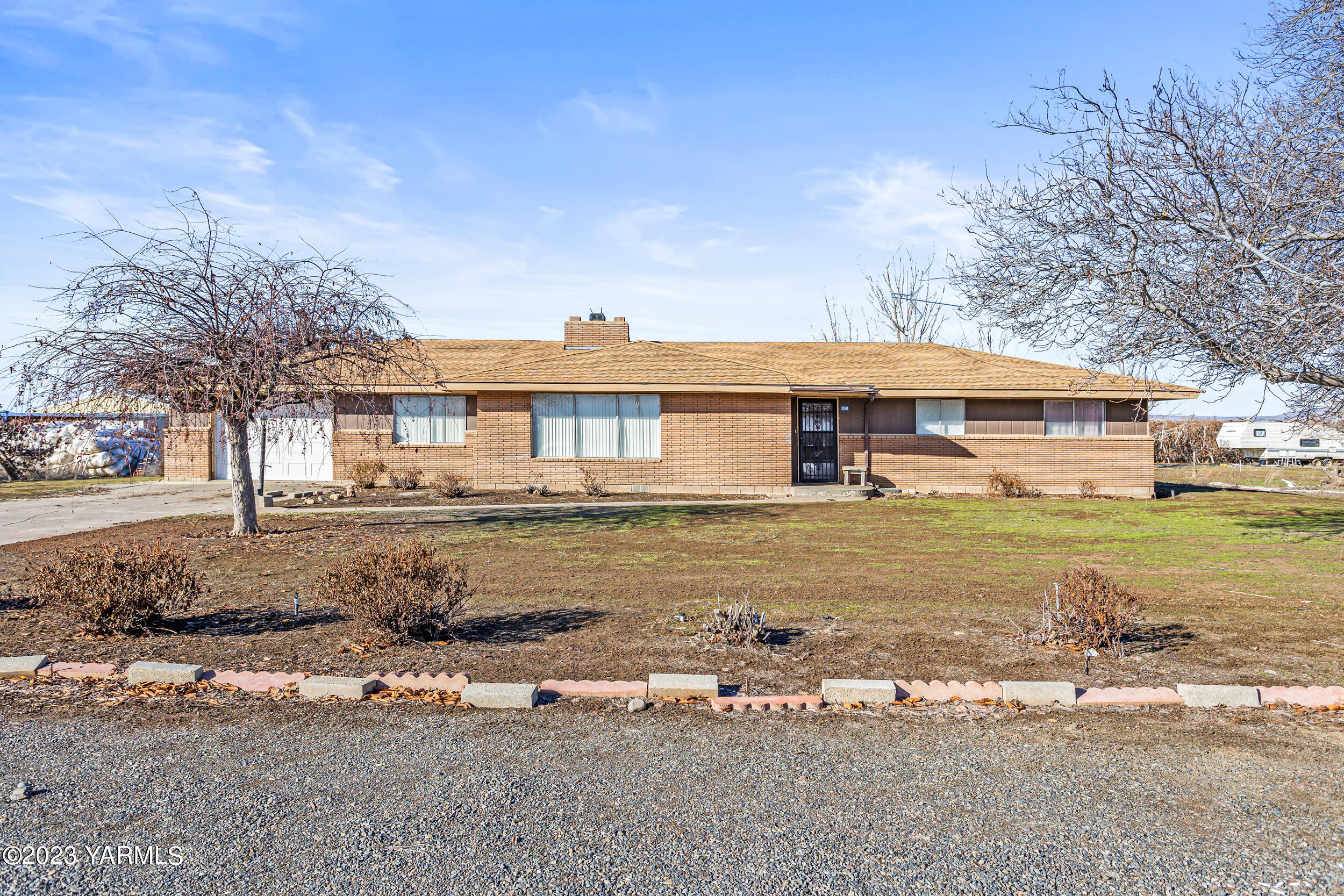 3570 Lateral B Road Wapato, WA 98951 - Photo 4 of 32 a front view of a house with a yard