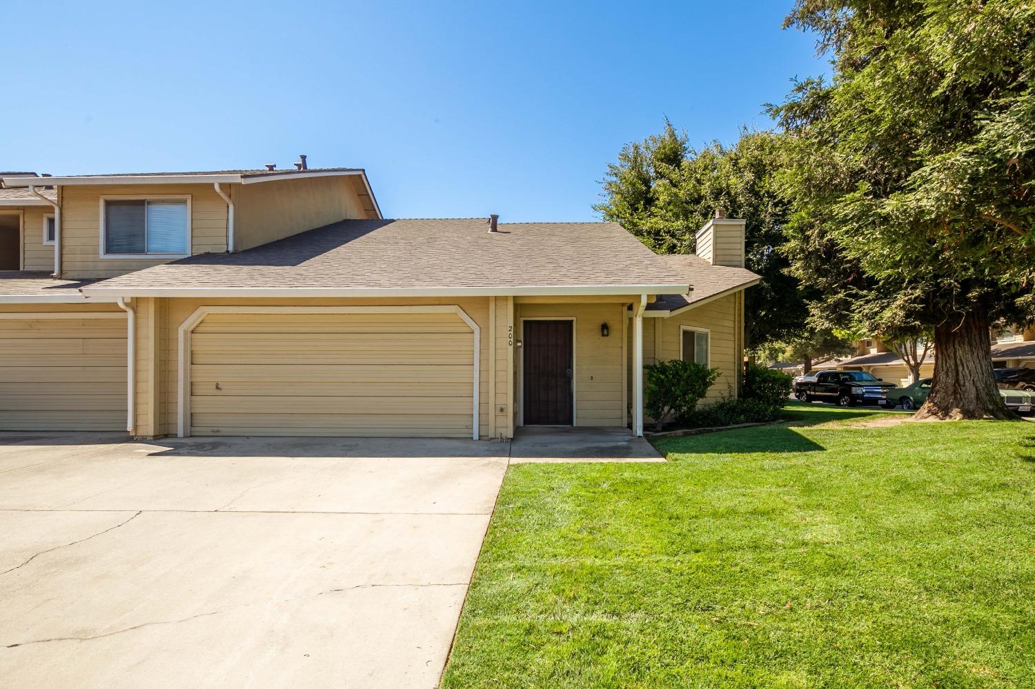 200 Gilbert Drive Ripon, CA 95366 - Photo 1 of 1 a front view of a house with a yard