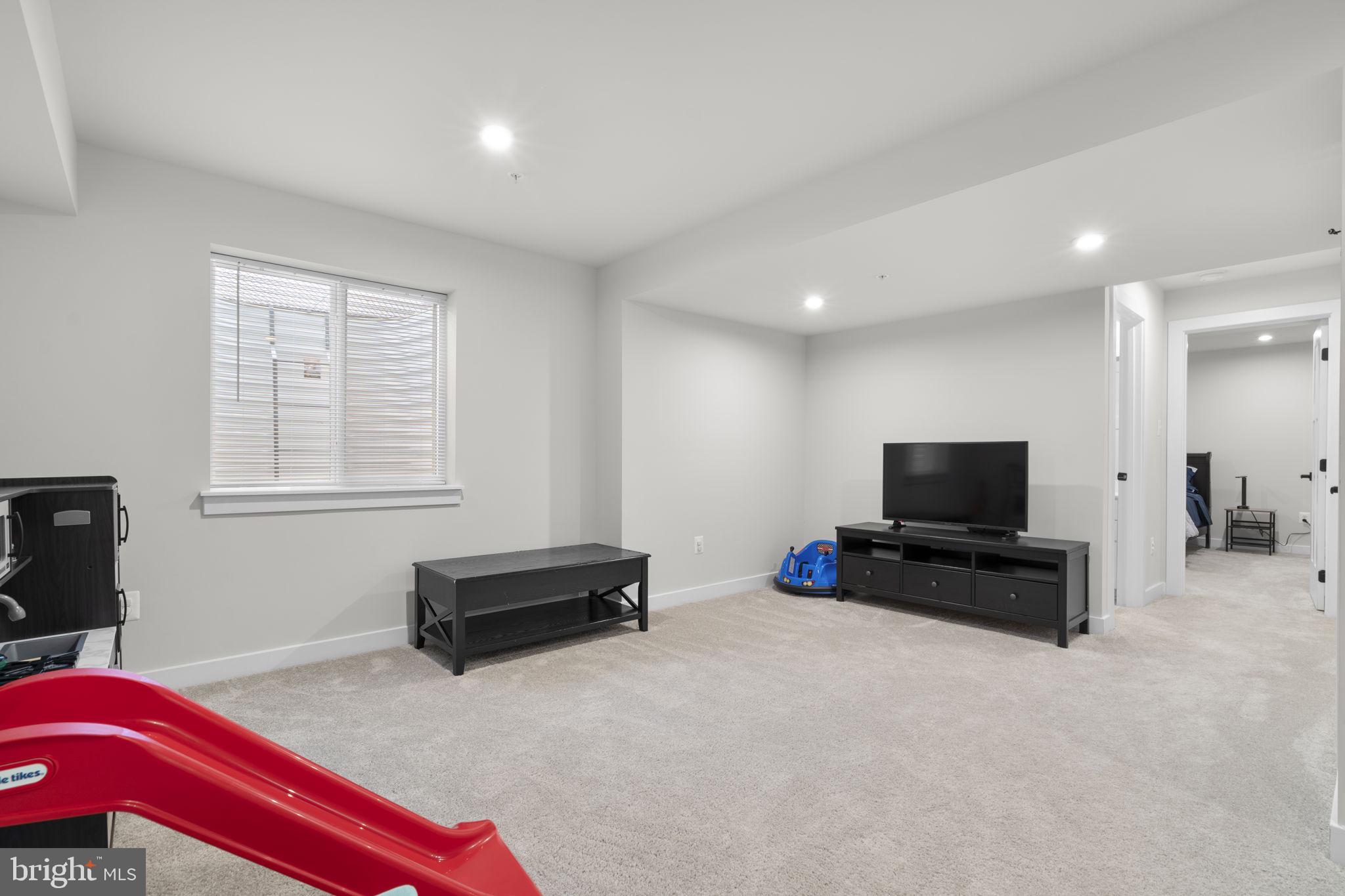 1713 Aurora Way Frederick, MD 21702 - Photo 46 of 57 a living room with furniture and a flat screen tv