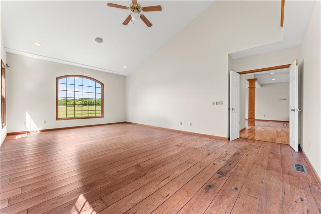810 Hamburg Road Fredonia, PA 16124 - Photo 19 of 45 an empty room with wooden floor fan and windows