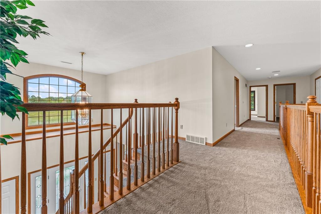 810 Hamburg Road Fredonia, PA 16124 - Photo 24 of 45 a view of a hallway with wooden floor and staircase
