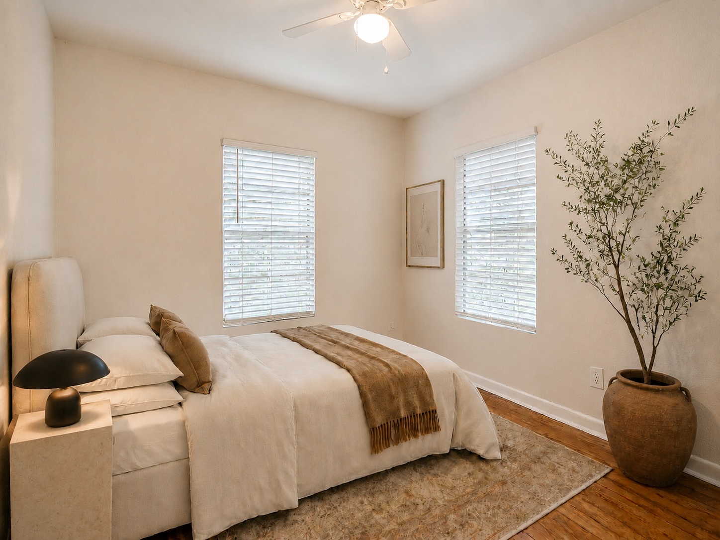 2009 Richcreek Road Austin, TX 78757 - Photo 11 of 23 Bedroom 2, Warm hardwood floors and multiple windows define this peaceful sleeping space.