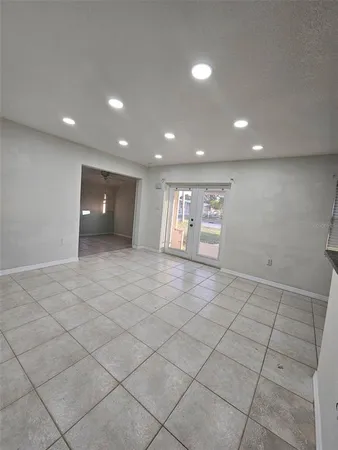 an empty room with a outdoor space and window