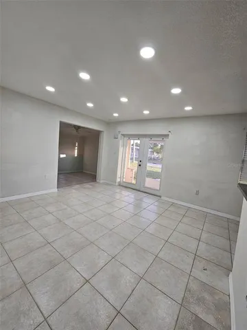 an empty room with a outdoor space and window