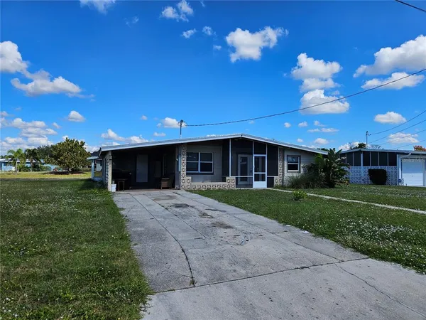 a view of a house with a back yard