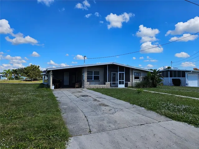 a view of a house with a back yard