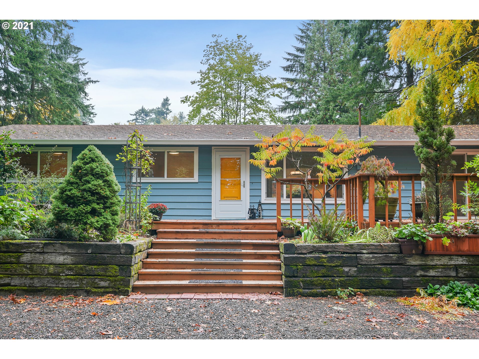 45 Southwest Collins Street Portland, OR 97219 - Photo 1 of 28 a front view of a house with a garden