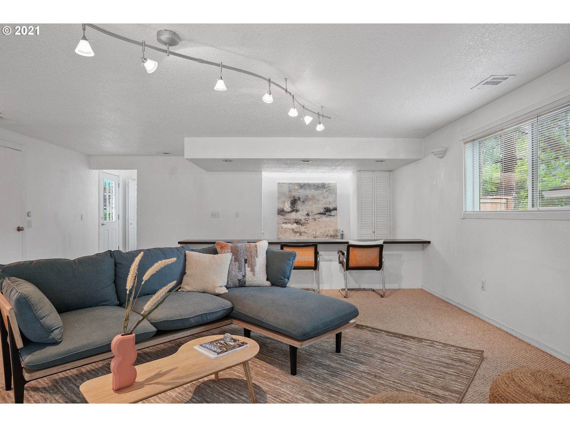 45 Southwest Collins Street Portland, OR 97219 - Photo 13 of 28 a living room with furniture and a wooden floor