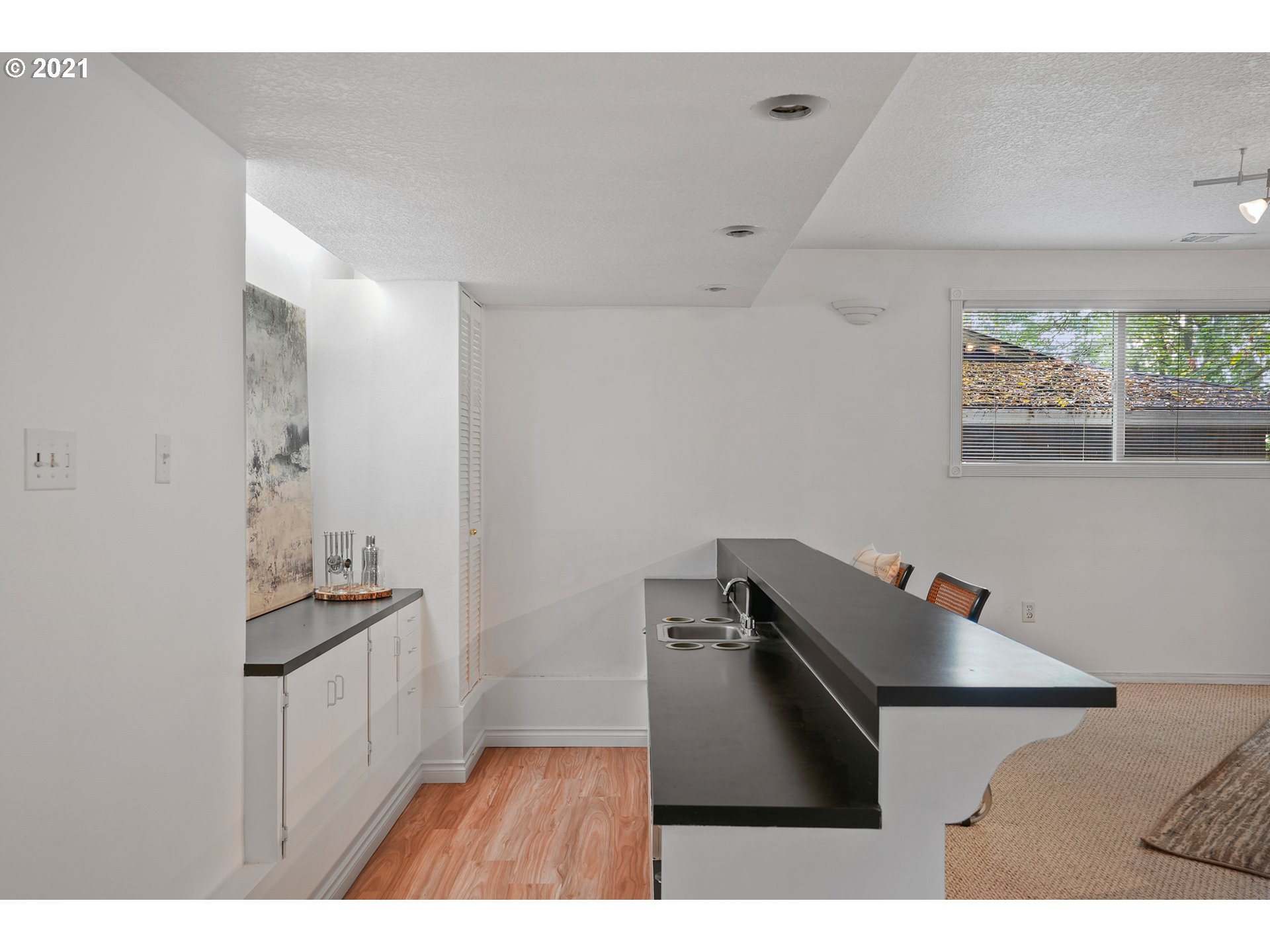 45 Southwest Collins Street Portland, OR 97219 - Photo 15 of 28 a kitchen with cabinets and window