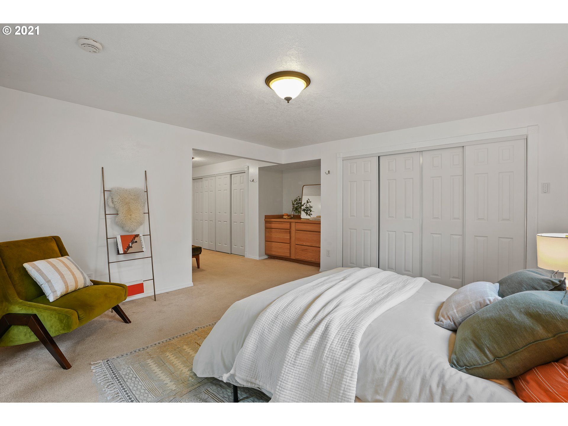 45 Southwest Collins Street Portland, OR 97219 - Photo 18 of 28 a bedroom with a bed and a desk