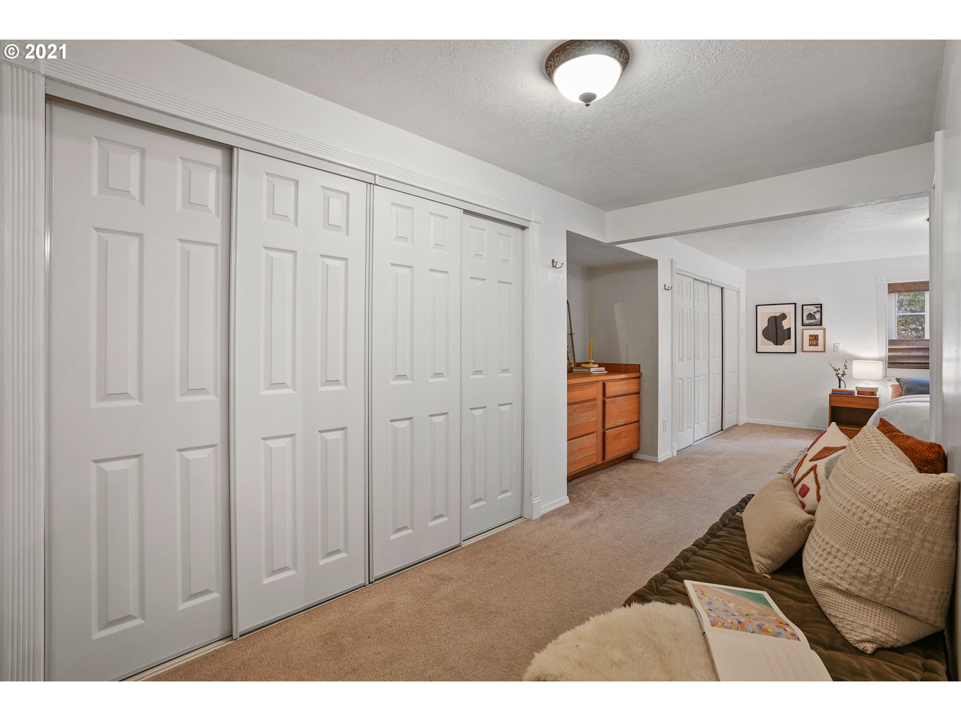 45 Southwest Collins Street Portland, OR 97219 - Photo 20 of 28 a bedroom with a bed and closet