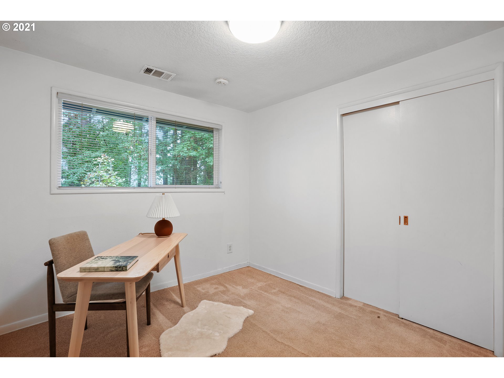 45 Southwest Collins Street Portland, OR 97219 - Photo 23 of 28 a workspace with furniture and a window