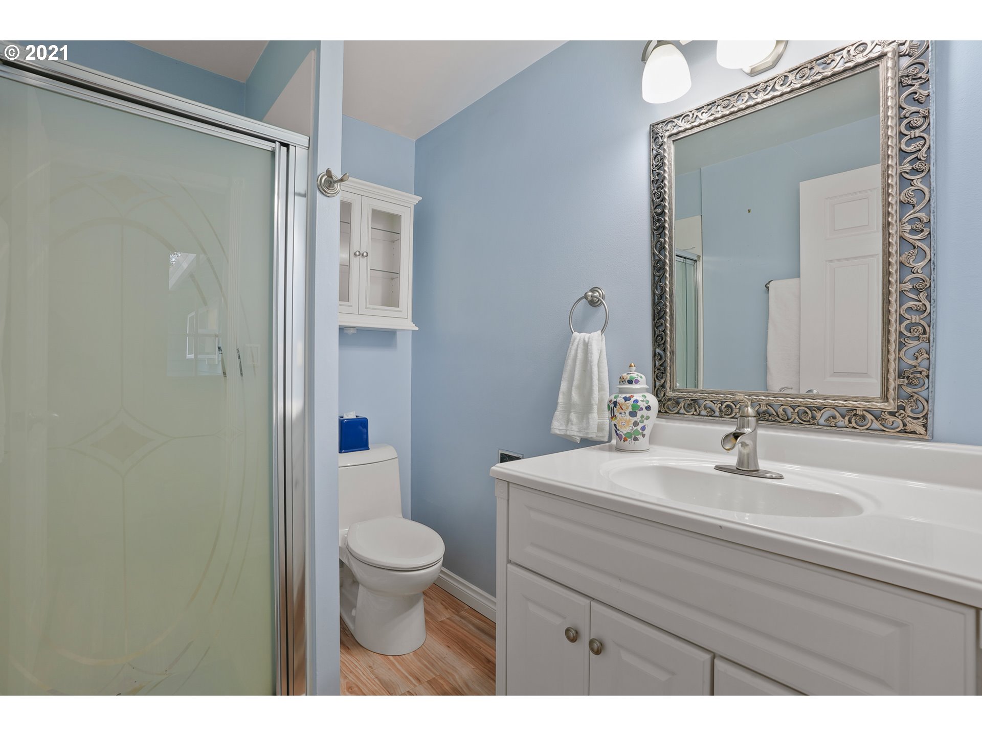 45 Southwest Collins Street Portland, OR 97219 - Photo 24 of 28 a bathroom with a sink a toilet and shower