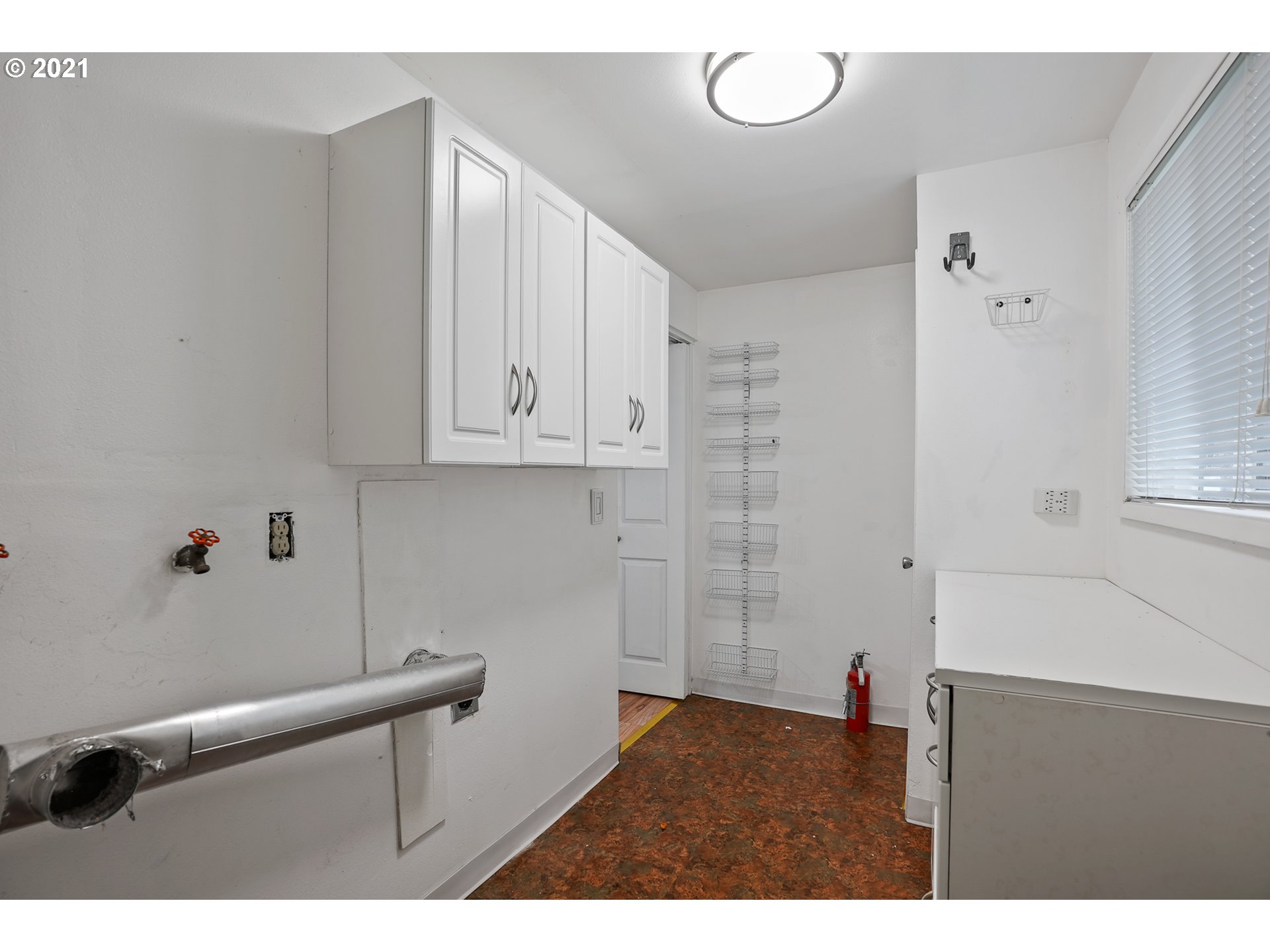 45 Southwest Collins Street Portland, OR 97219 - Photo 25 of 28 a kitchen with cabinets and window
