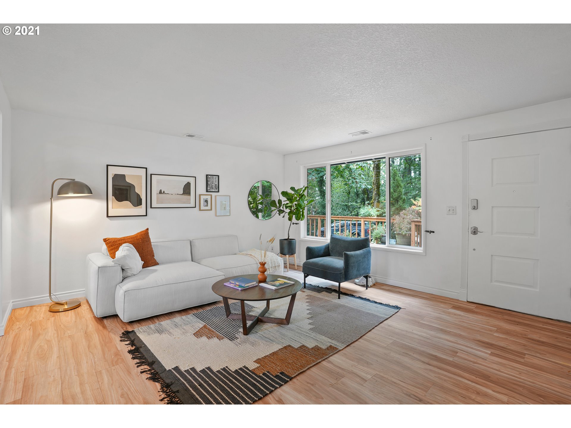 45 Southwest Collins Street Portland, OR 97219 - Photo 5 of 28 a living room with furniture and a window