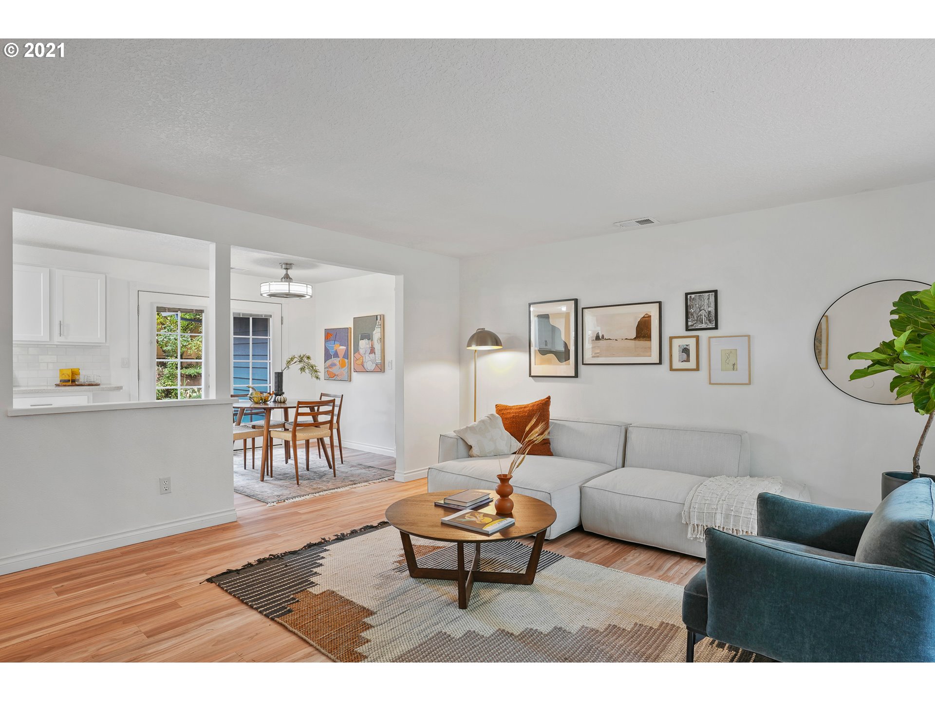 45 Southwest Collins Street Portland, OR 97219 - Photo 6 of 28 a living room with furniture and a wooden floor