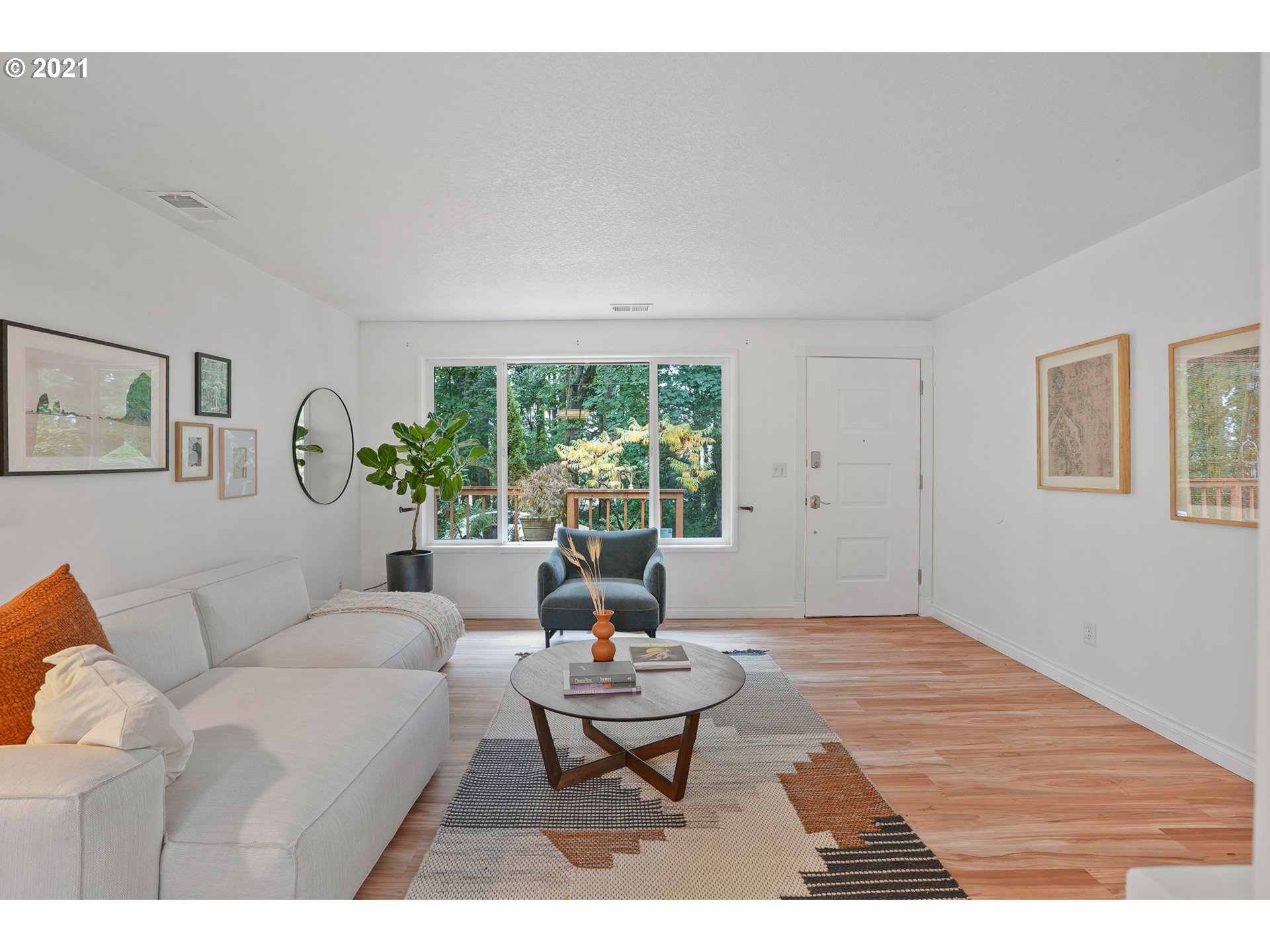 45 Southwest Collins Street Portland, OR 97219 - Photo 7 of 28 a living room with furniture and a large window