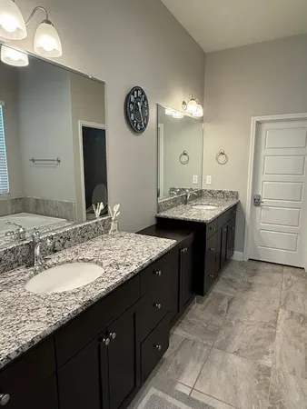 a bath tub sitting next to a shower