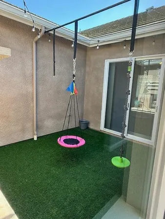 a view of a room with a table and a potted plant