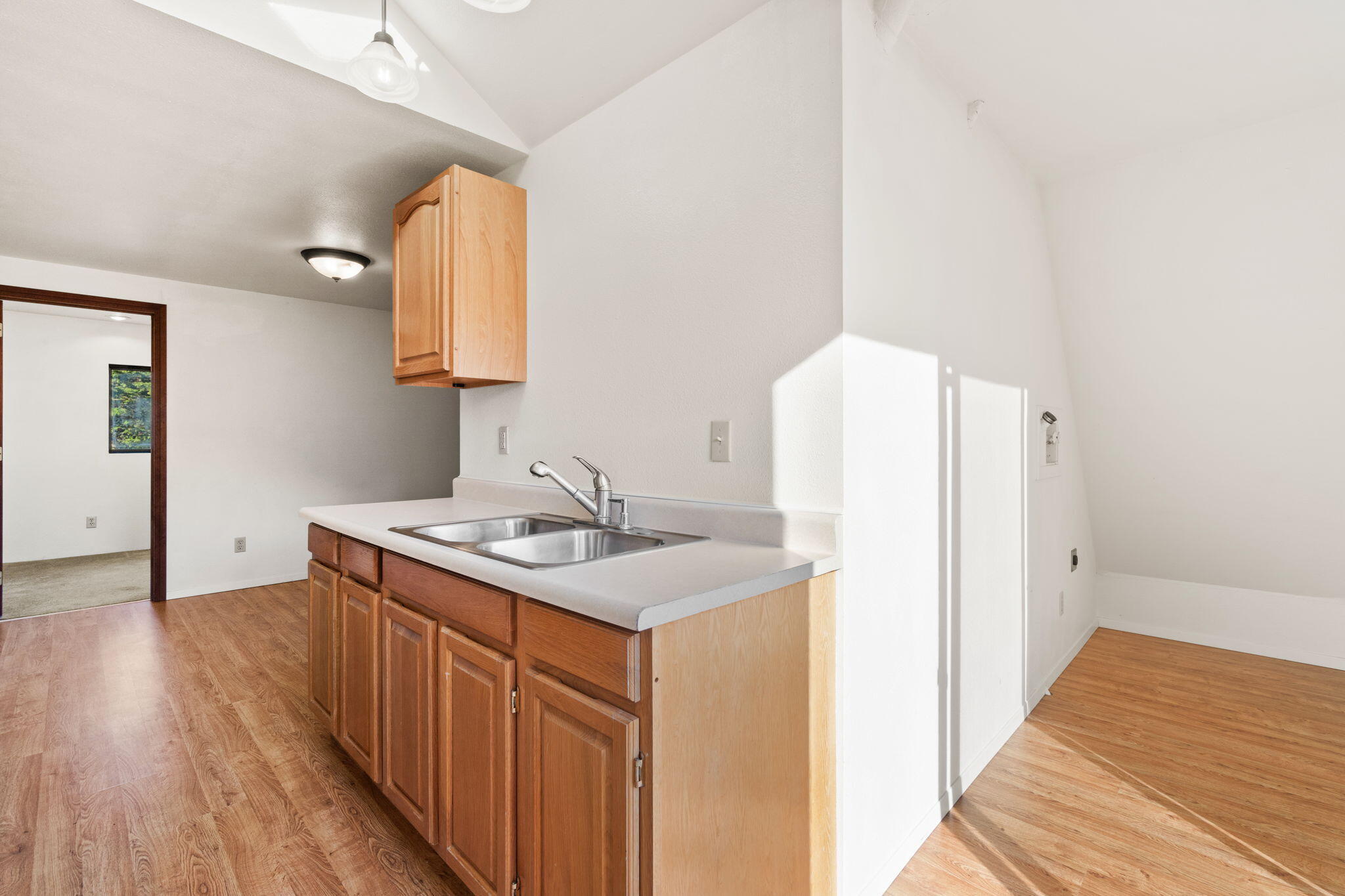 61 Kingston Road Fieldbrook, CA 95519 - Photo 27 of 48 a kitchen with a sink a refrigerator and wooden floor