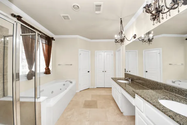 a large spacious bathroom with a granite countertop tub sink and mirror