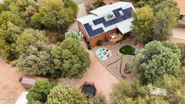 an aerial view of a house with a yard