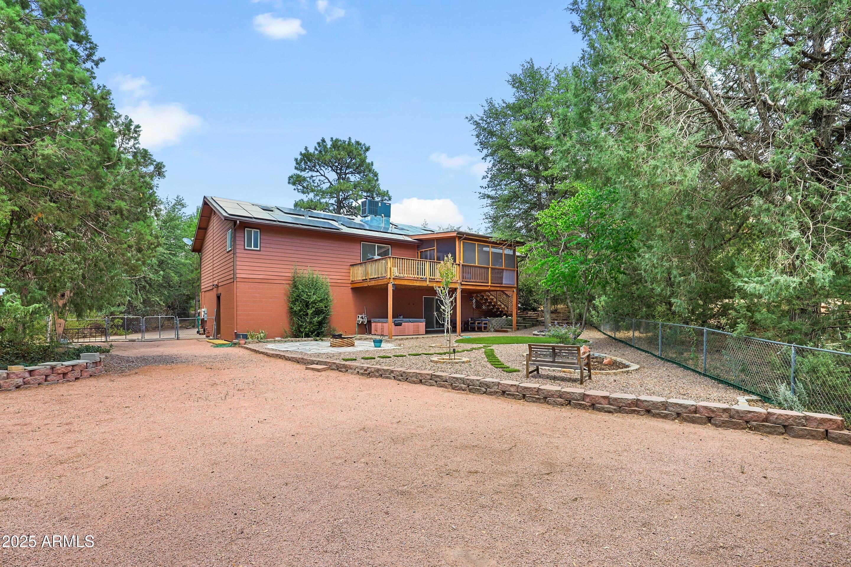 1506 North Easy Street Payson, AZ 85541 - Photo 6 of 17 a front view of a house with a yard and potted plants