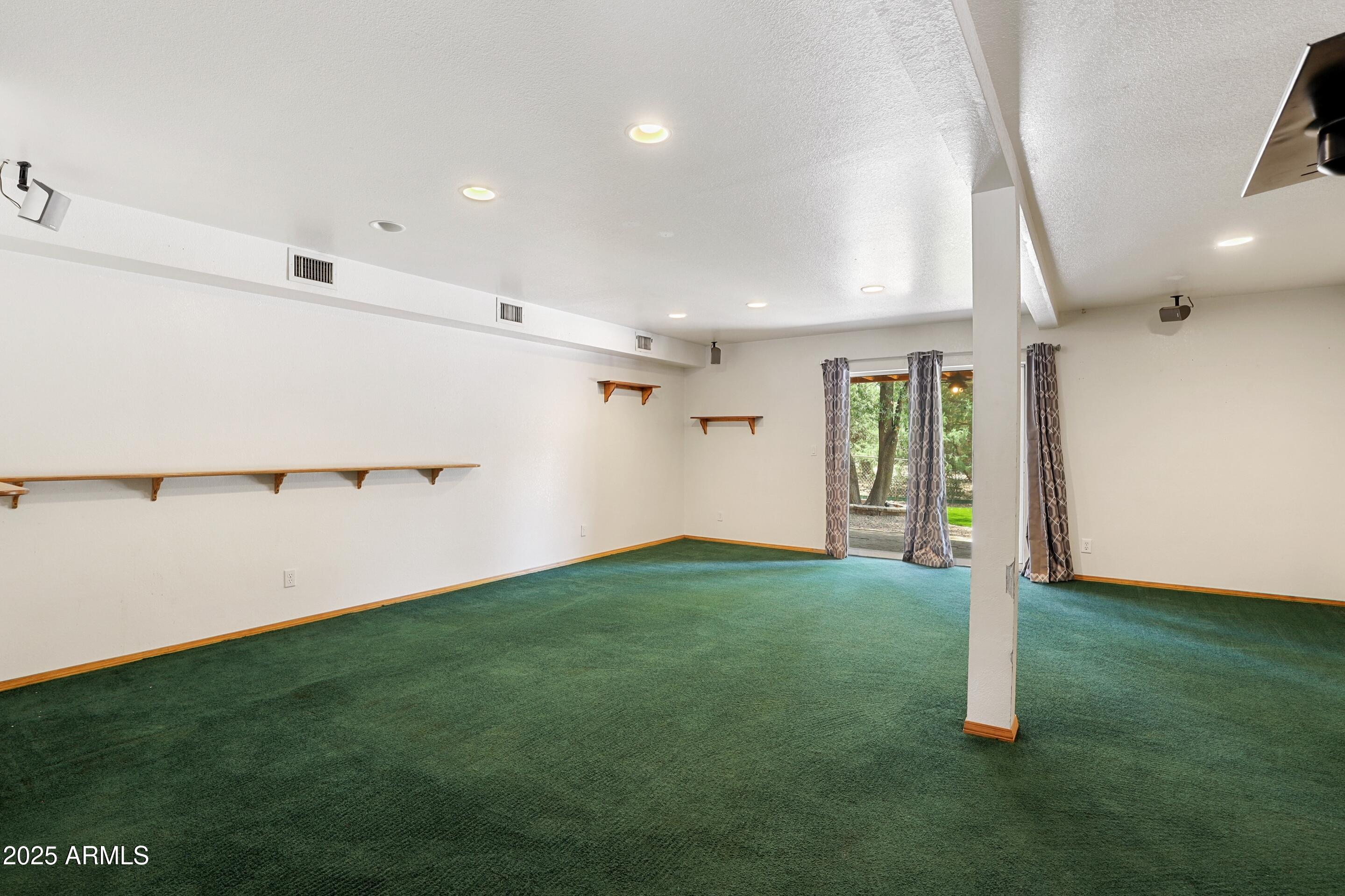1506 North Easy Street Payson, AZ 85541 - Photo 8 of 17 a view of a big room with wooden floor and windows