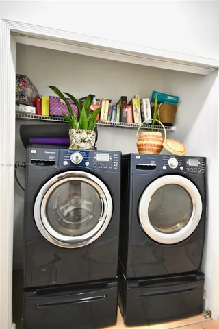 a view of a backyard with table and chairs with wooden fence