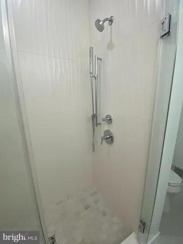 a bathroom with a double vanity sink and mirror