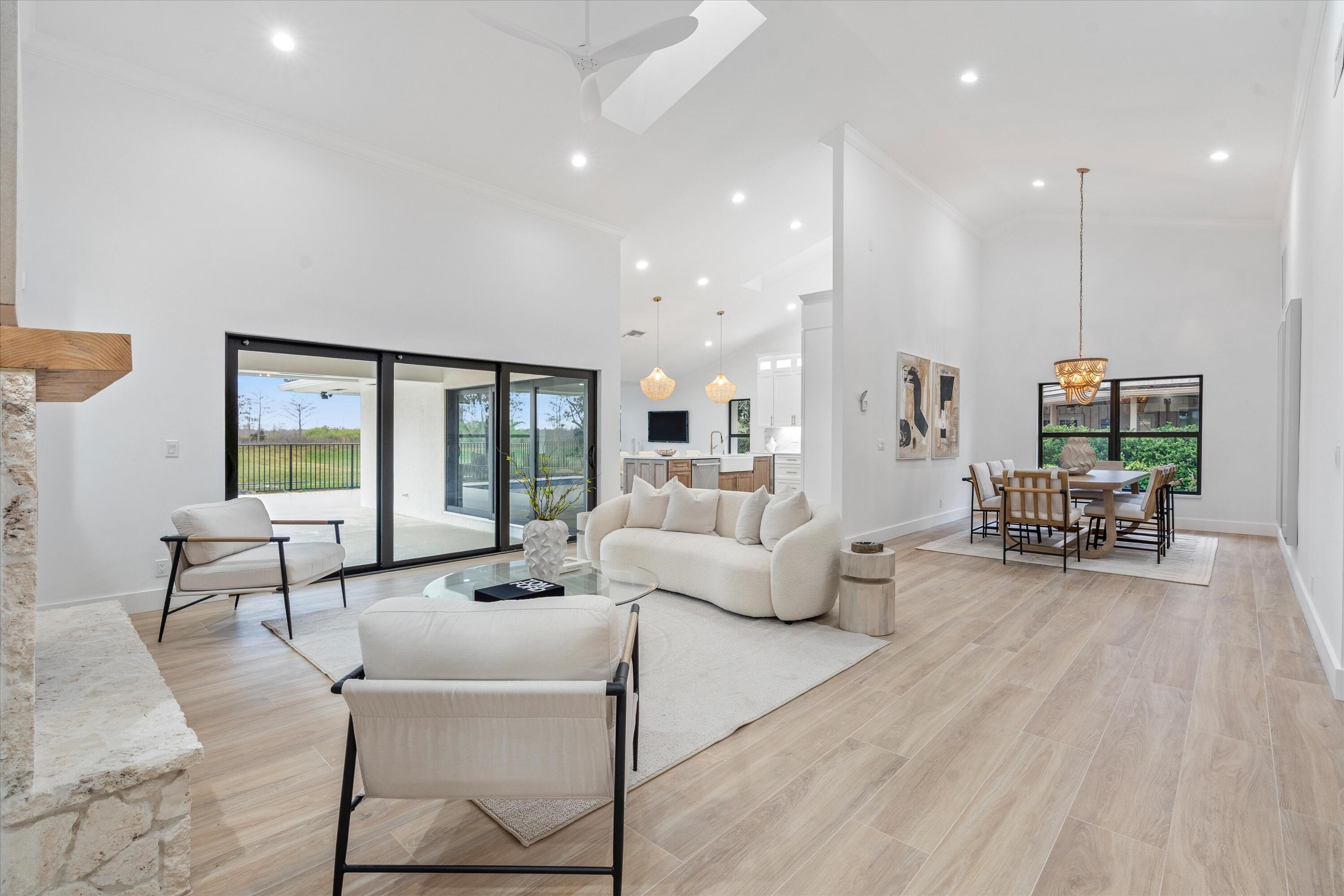 24 Dunbar Road Palm Beach Gardens, FL 33418 - Photo 17 of 93 a living room with furniture and a large window