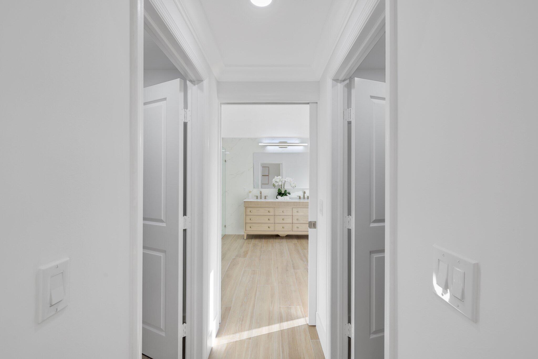24 Dunbar Road Palm Beach Gardens, FL 33418 - Photo 43 of 93 a bathroom with a glass shower door