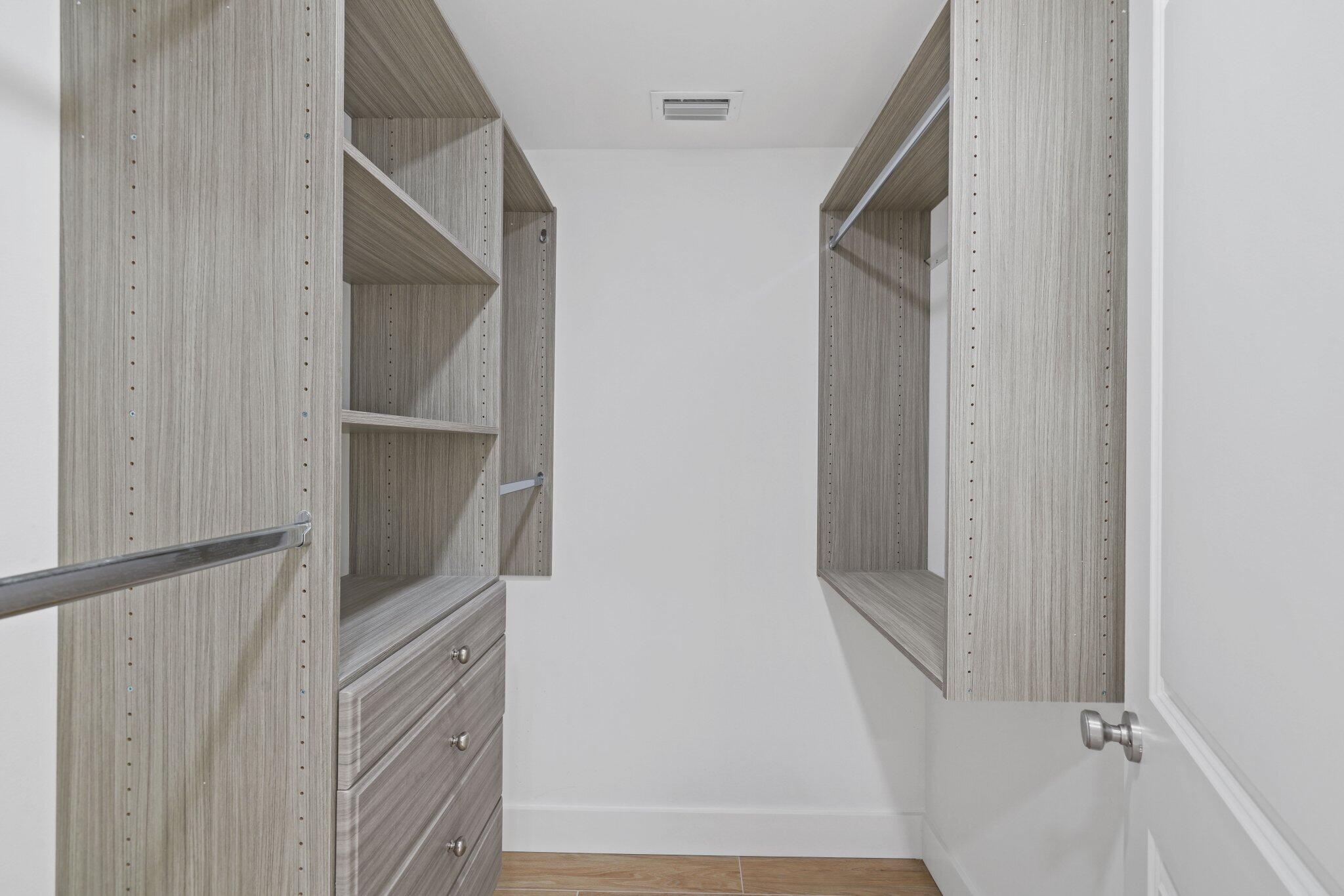 24 Dunbar Road Palm Beach Gardens, FL 33418 - Photo 48 of 93 a view of staircase with white walls and door