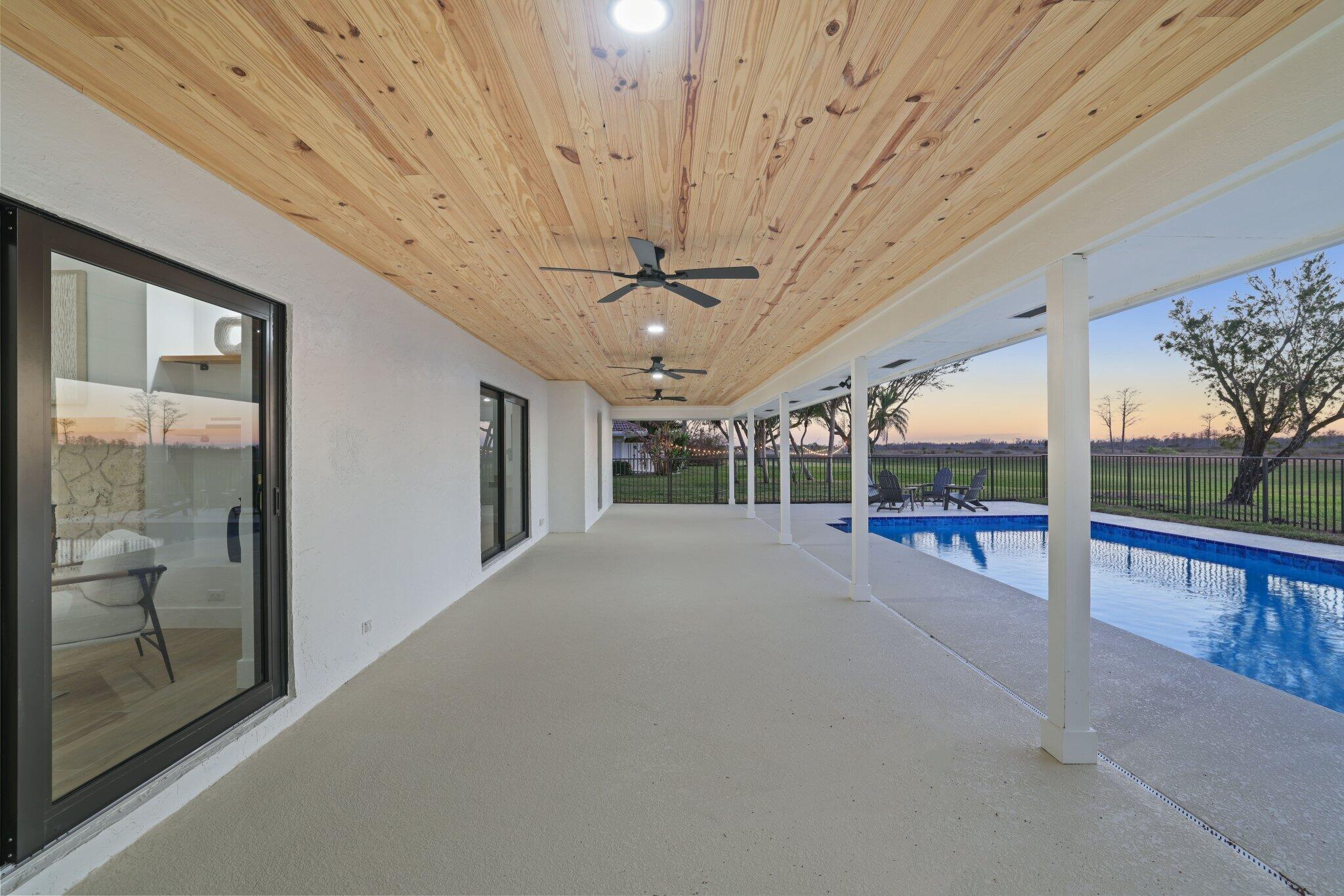 24 Dunbar Road Palm Beach Gardens, FL 33418 - Photo 70 of 93 a view of a porch