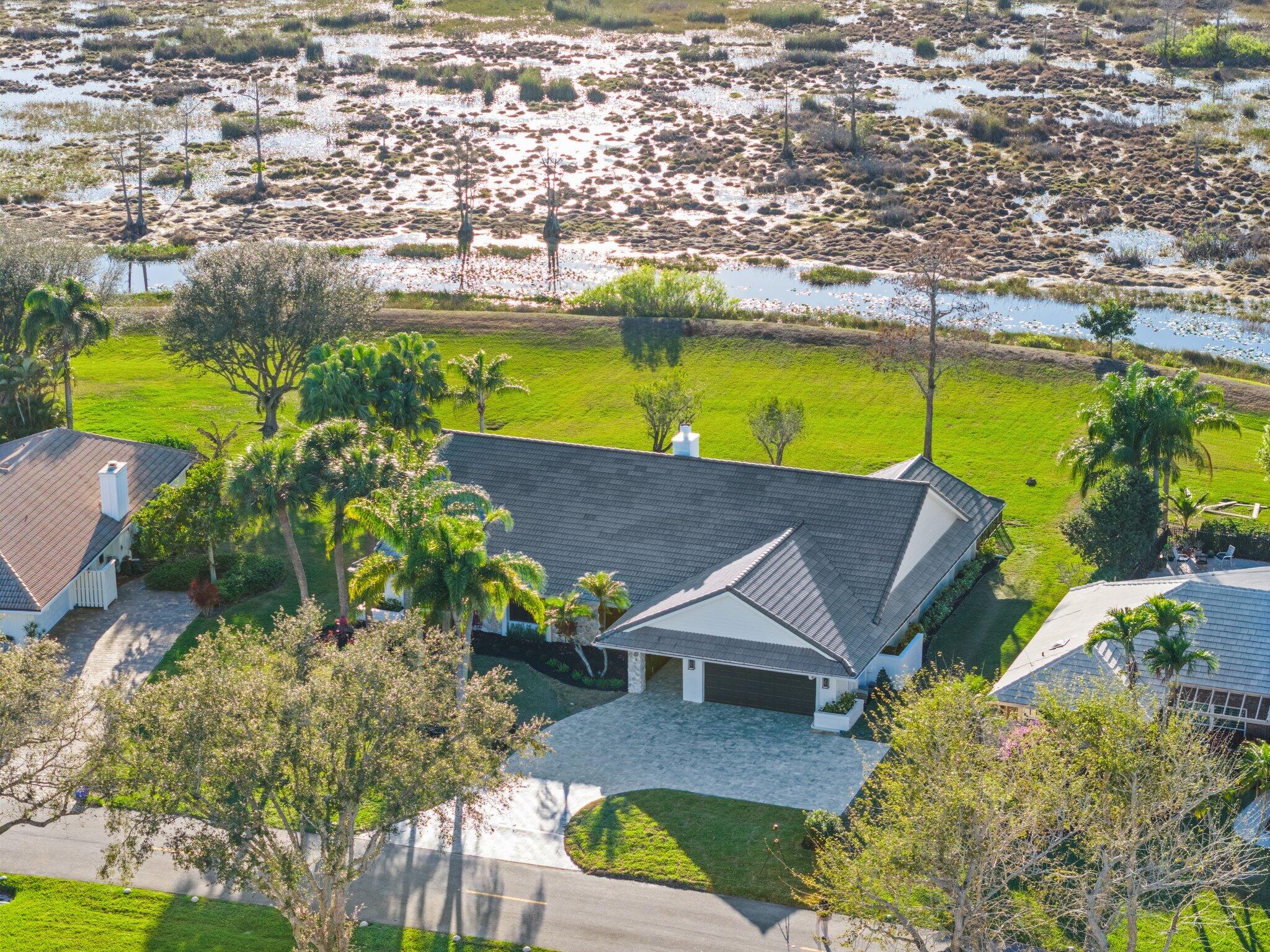 24 Dunbar Road Palm Beach Gardens, FL 33418 - Photo 82 of 93 an aerial view of a house with a ocean view