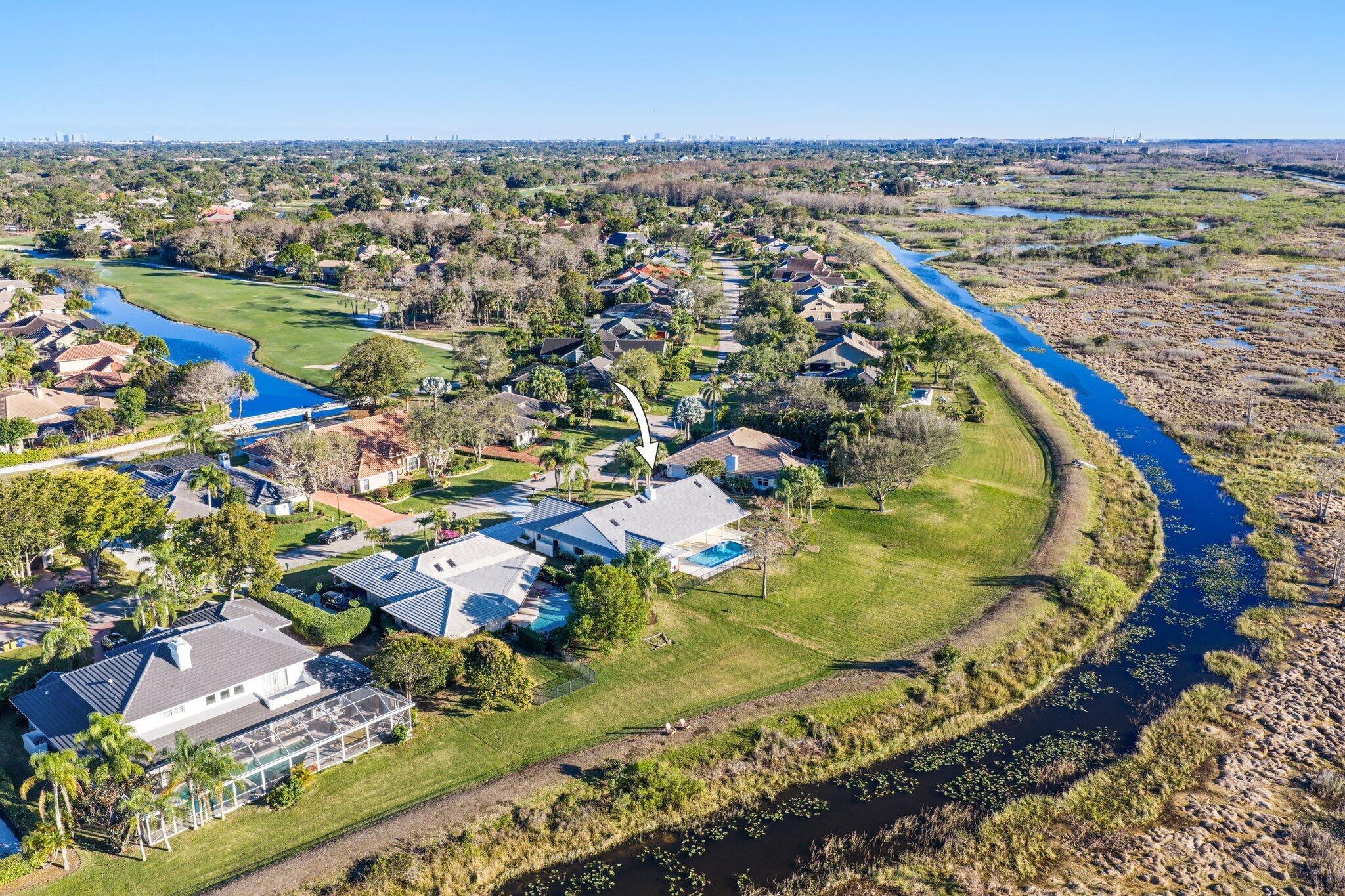 24 Dunbar Road Palm Beach Gardens, FL 33418 - Photo 87 of 93 an aerial view of residential houses with outdoor space