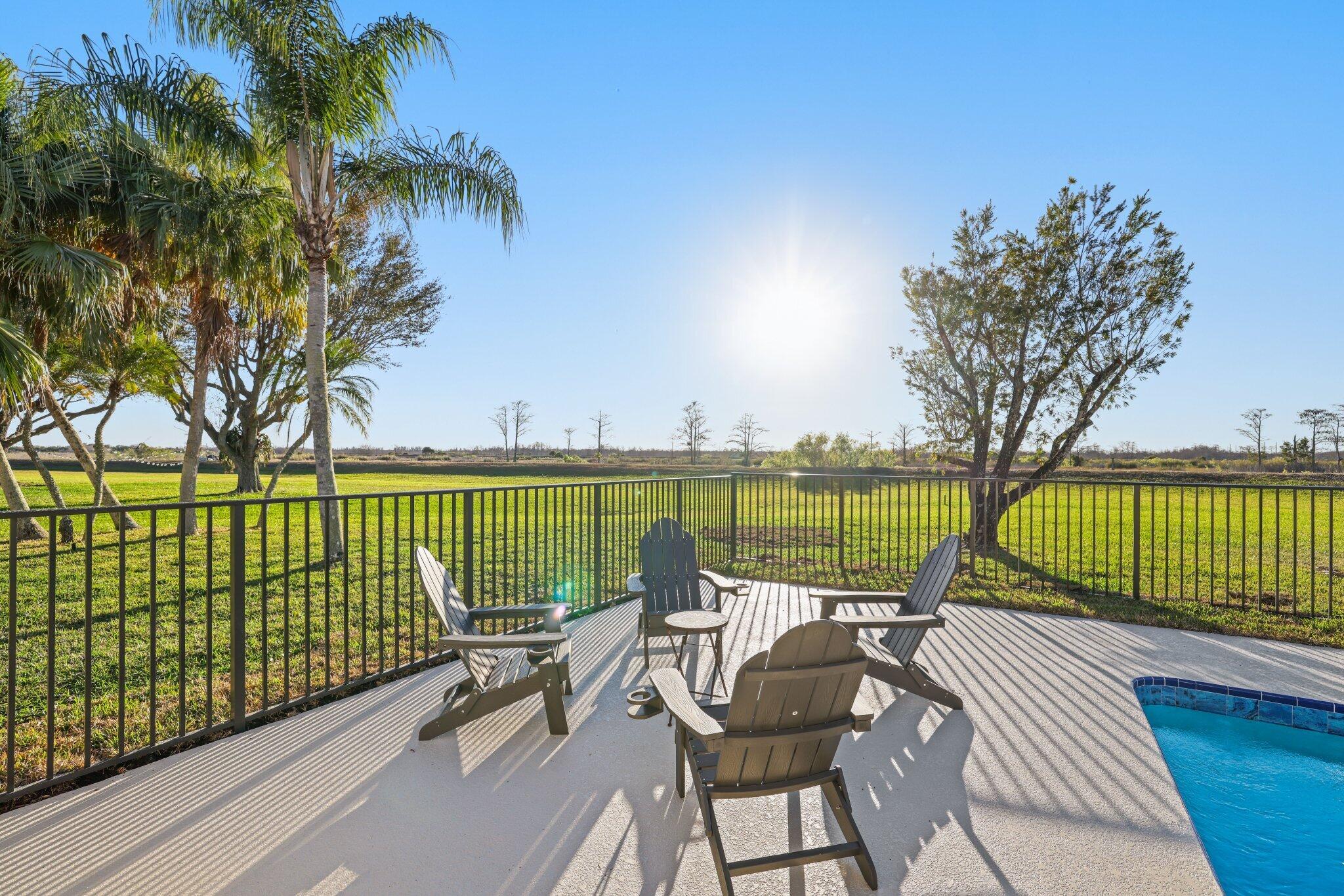 24 Dunbar Road Palm Beach Gardens, FL 33418 - Photo 90 of 93 a view of swimming pool with outdoor seating and city view