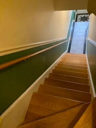 a view of balcony with wooden floor