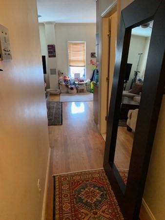 328 Sumner Street, Unit 2 Boston, MA 02128 - Photo 3 of 15 a view of hallway with furniture and a window