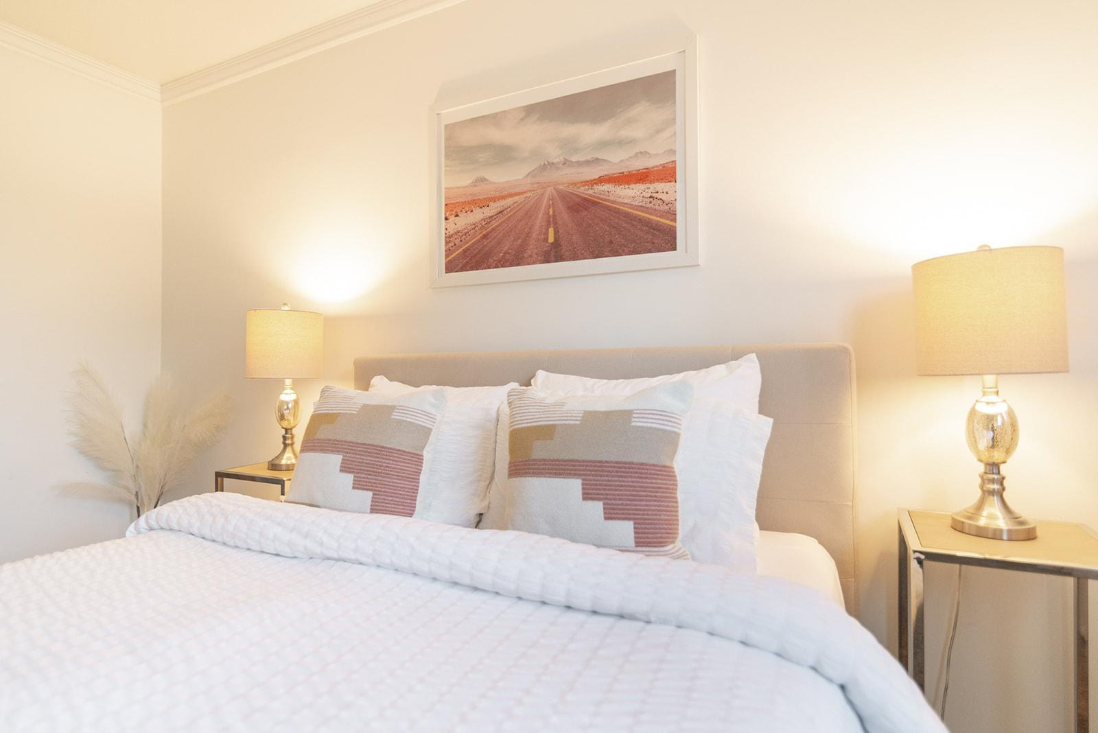7435 East Granada Road Scottsdale, AZ 85257 - Photo 24 of 28 a bed room with a bed and a lamp