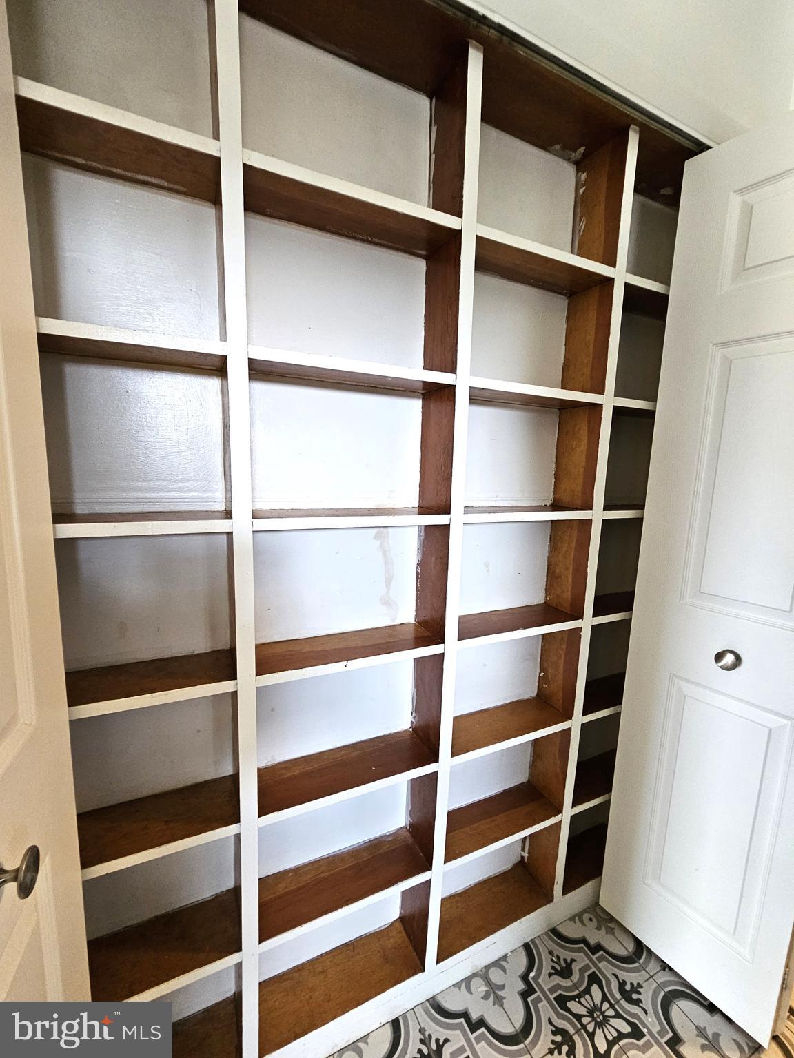 103 Shawnee Circle Cambridge, MD 21613 - Photo 13 of 49 a view of walk in closet with empty racks