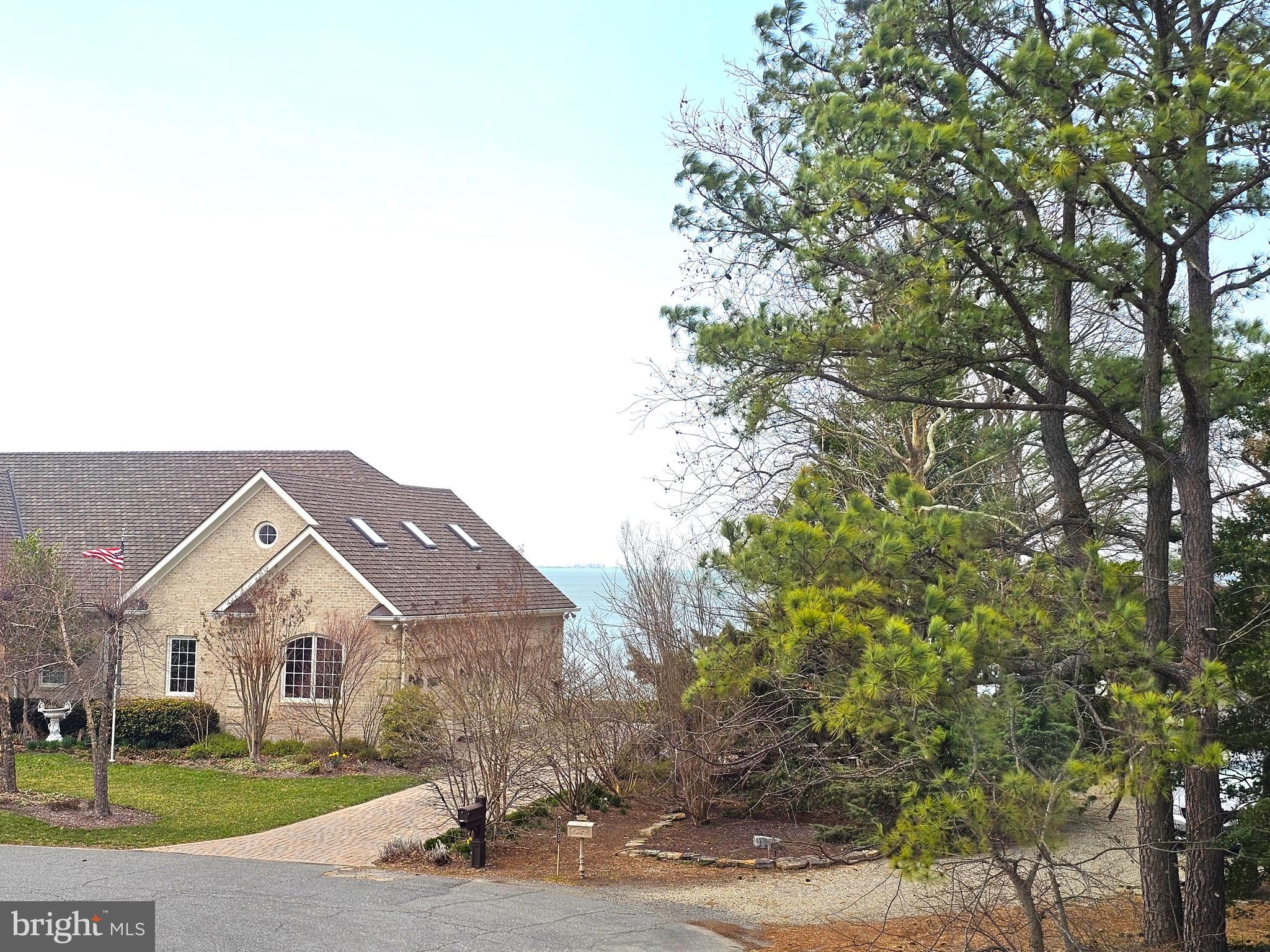 103 Shawnee Circle Cambridge, MD 21613 - Photo 20 of 49 a front view of a house with a yard