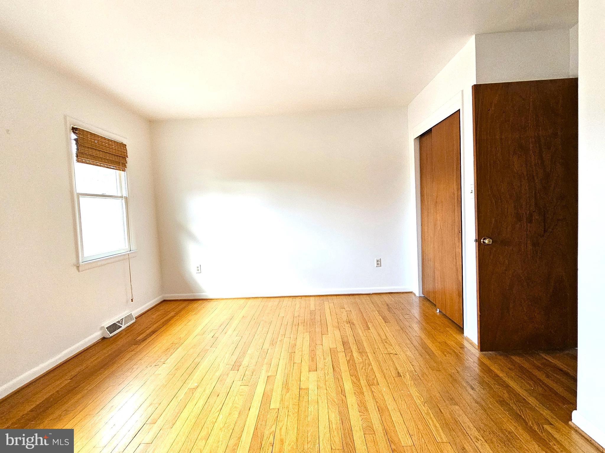 103 Shawnee Circle Cambridge, MD 21613 - Photo 24 of 49 a view of a room with wooden floor and a window