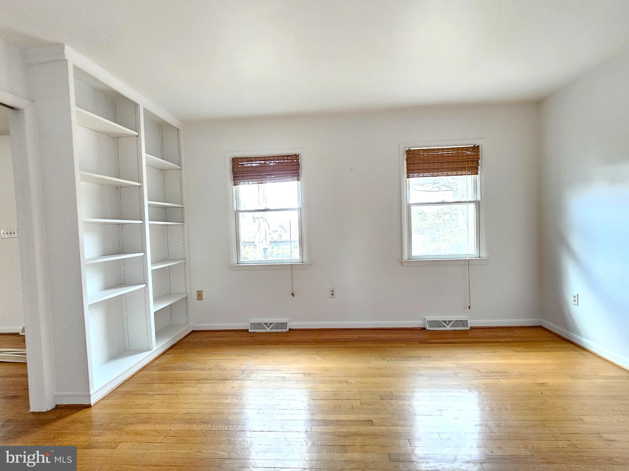 103 Shawnee Circle Cambridge, MD 21613 - Photo 25 of 49 an empty room with wooden floor and windows