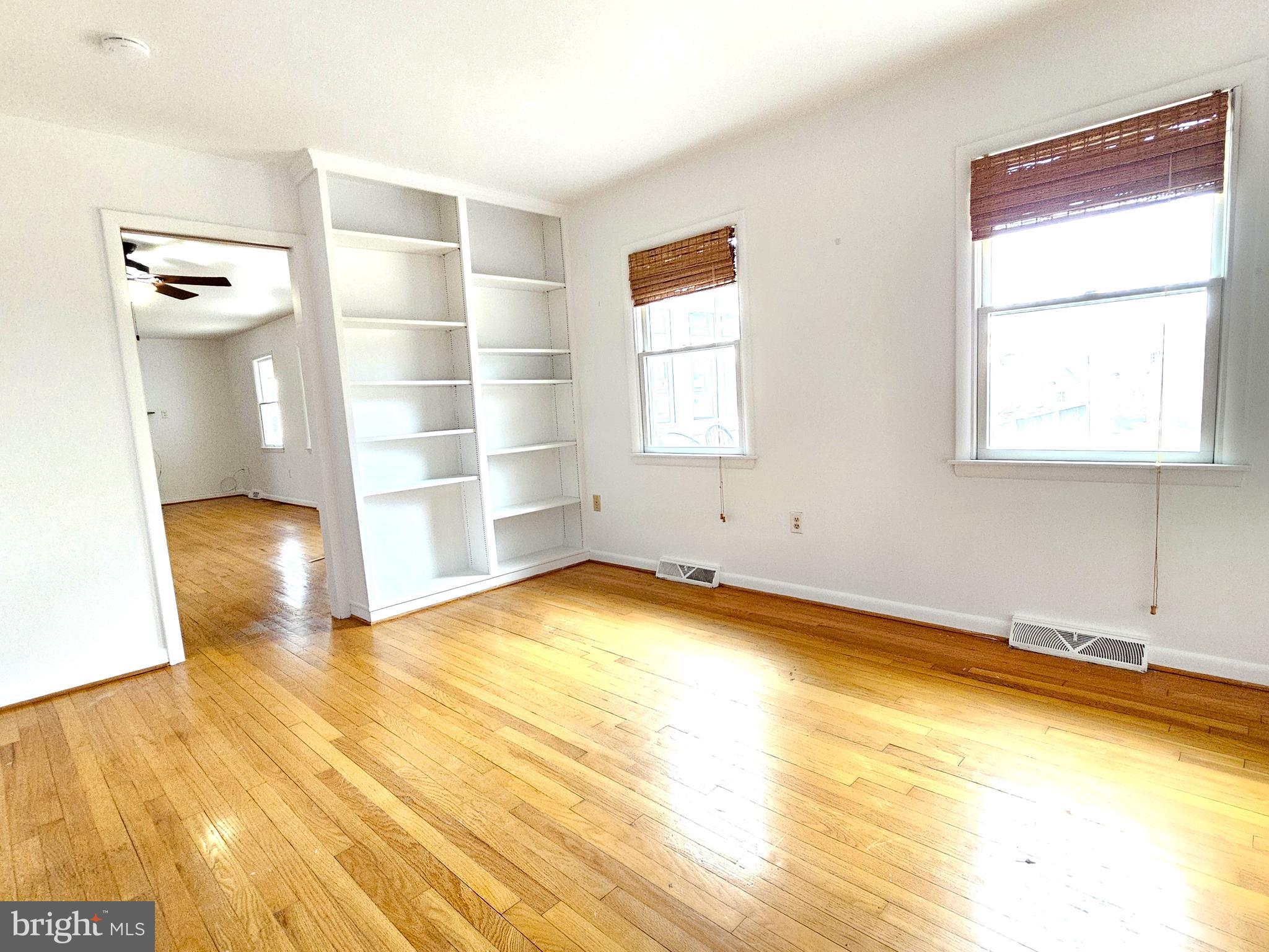 103 Shawnee Circle Cambridge, MD 21613 - Photo 26 of 49 a view of empty room with wooden floor and fan