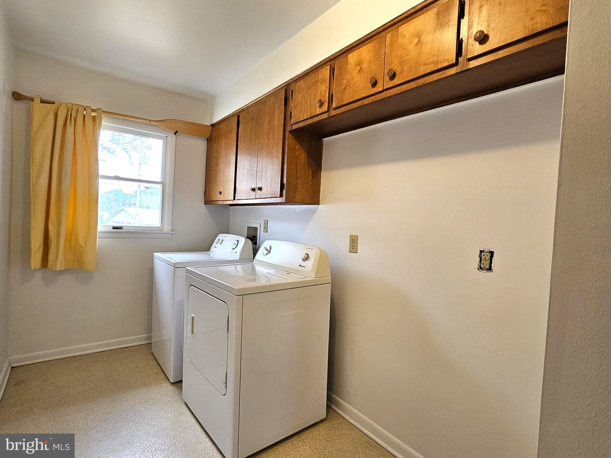 103 Shawnee Circle Cambridge, MD 21613 - Photo 27 of 49 a utility room with a sink a window and washer