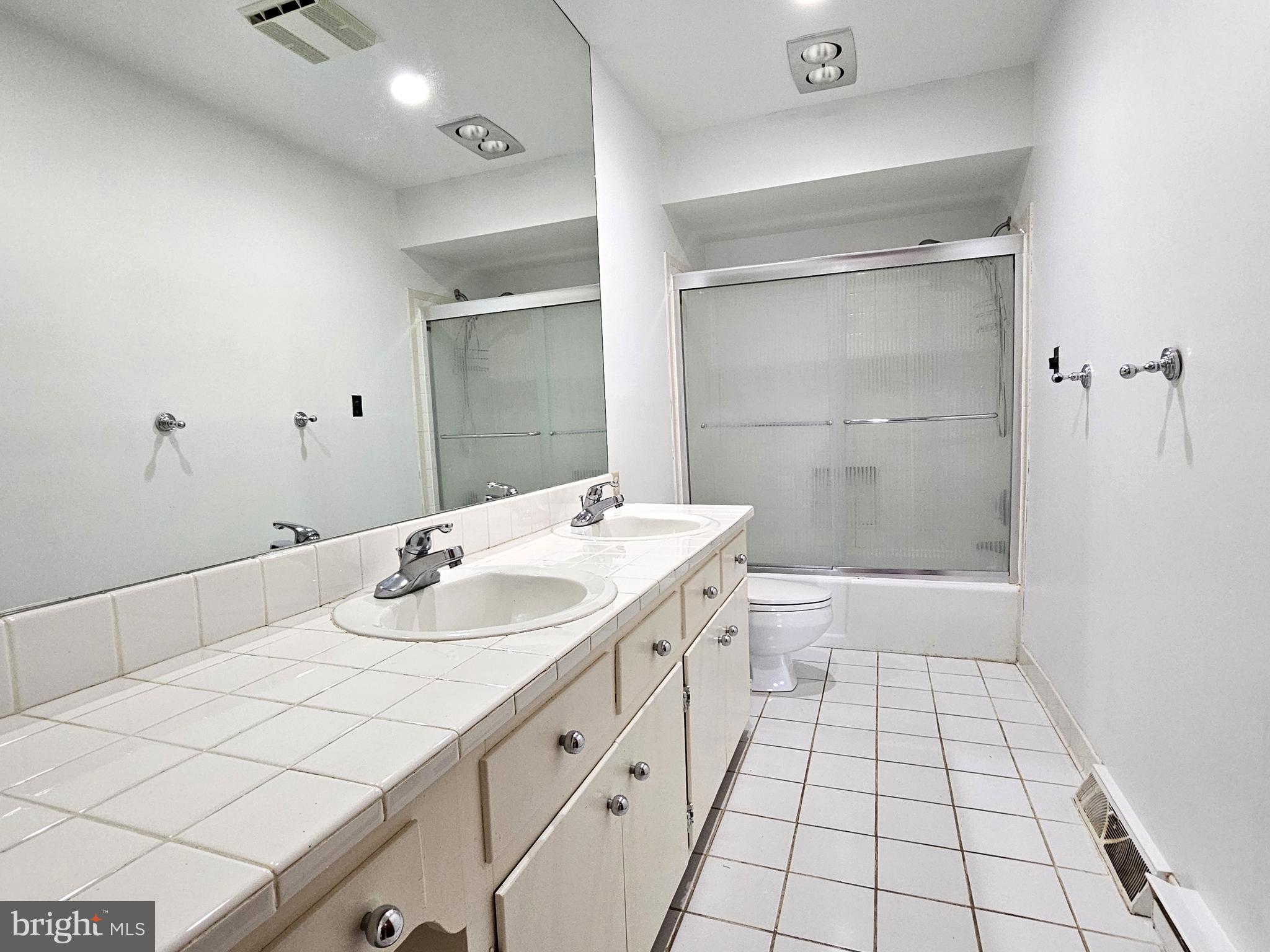 103 Shawnee Circle Cambridge, MD 21613 - Photo 29 of 49 a bathroom with a sink a toilet and shower