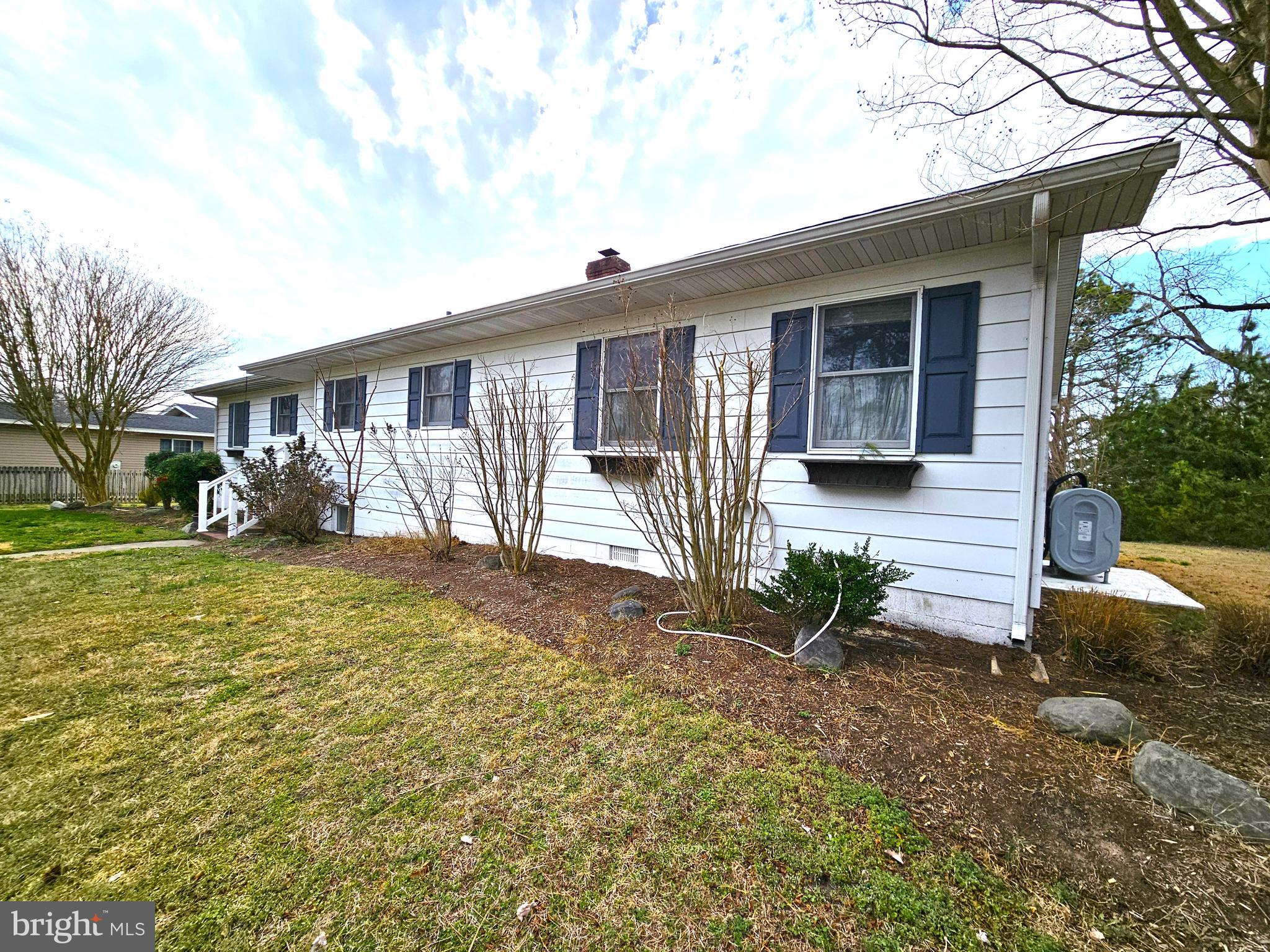 103 Shawnee Circle Cambridge, MD 21613 - Photo 3 of 49 a front view of a house with garden